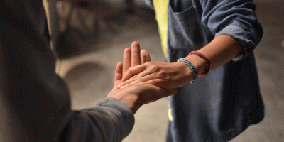 a couples hands clasped
