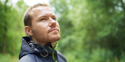 man's face amid nature