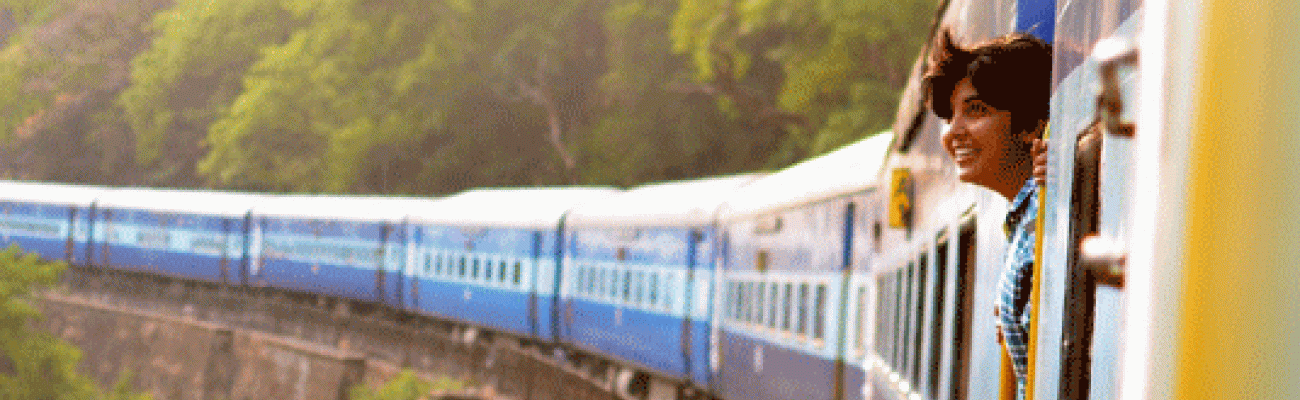 woman looking out of a train window