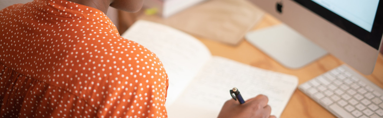 Woman writing in a journal